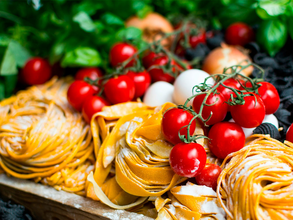pasta-cooking-class-fresh-ingredients-tagliatelle-tomatoes Fresh tagliatelle pasta and local ingredients for a private cooking class experience at Villa Wirnica; taste Italian Lifestyle Experience