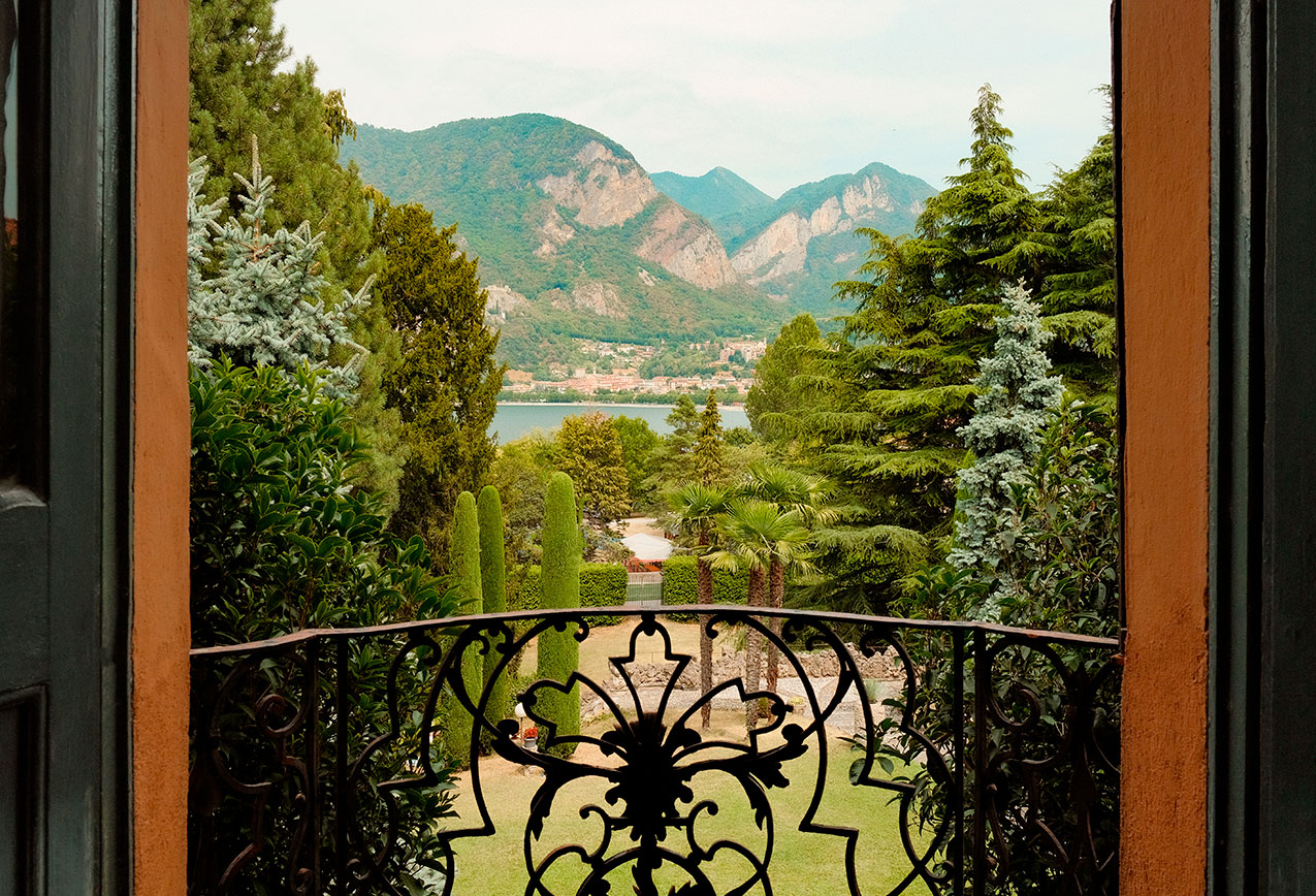 Spectacular panoramic view of Lake Garlate and mountains from a luxury suite balcony at Villa Wirnica