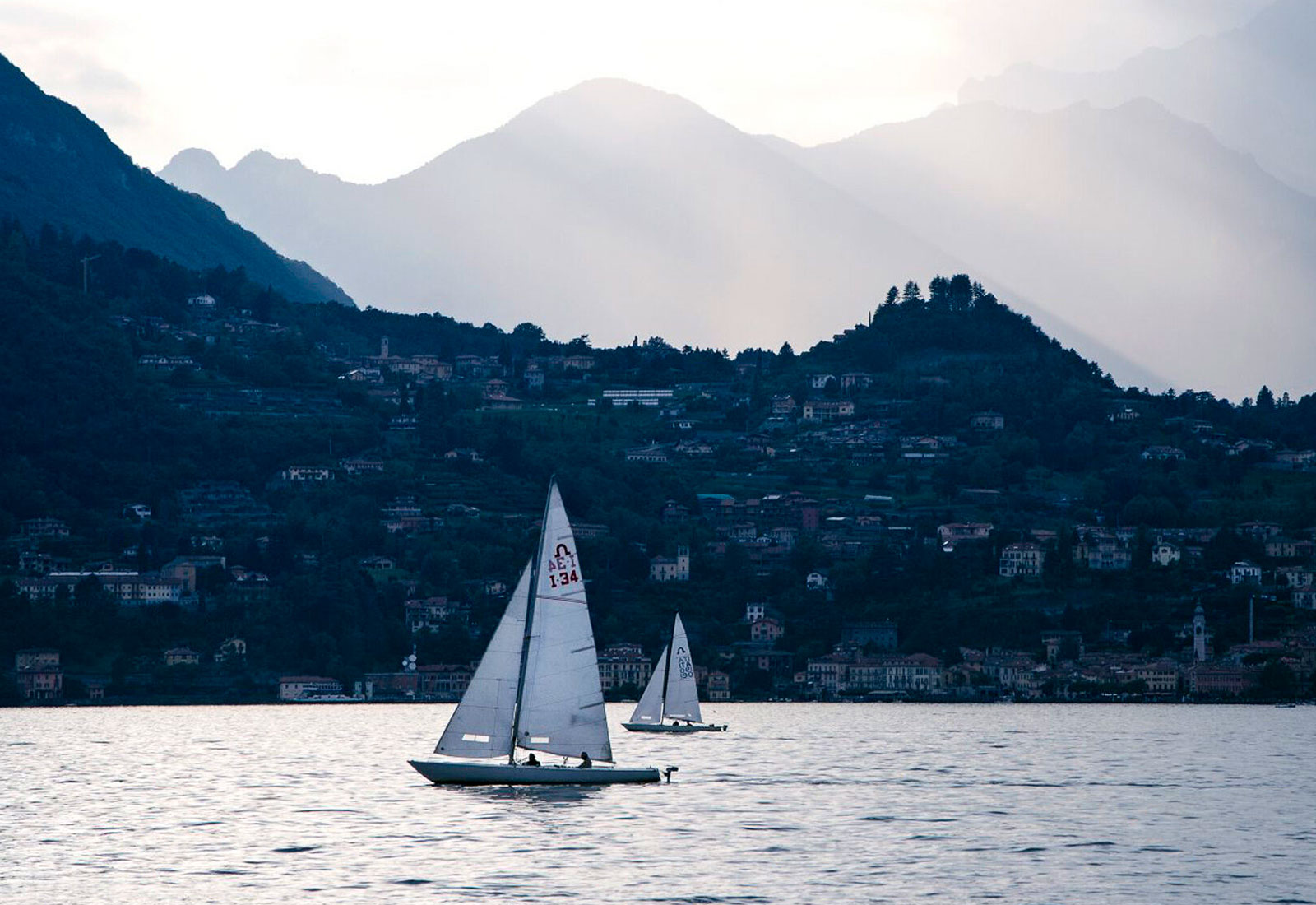 sailing-on-lake-como-water-sports-activity-mountains-2 Sailing on Lake Como: water sports activity with dramatic mountain scenery, available for exclusive villa guests. Format for Photo Gallery